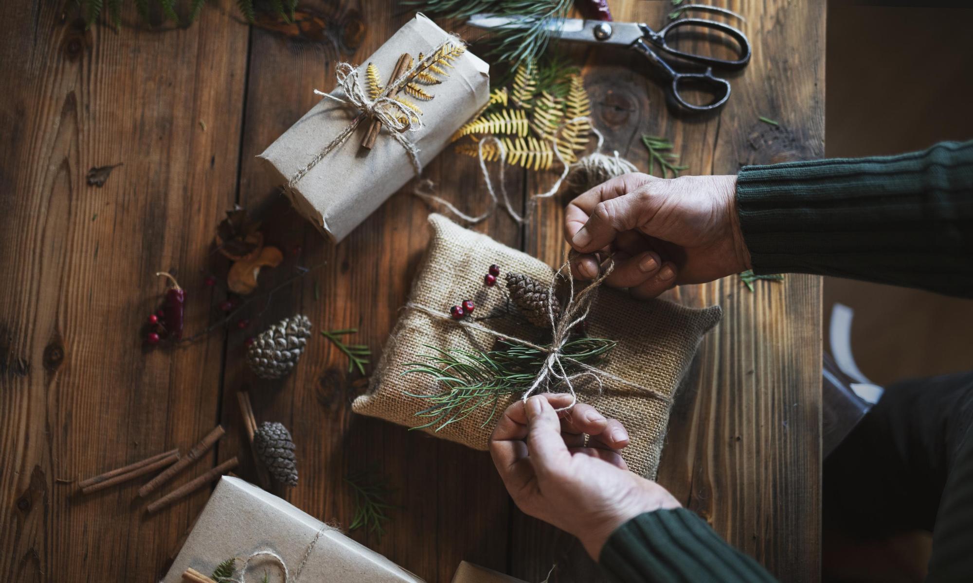 Person wrapping Christmas gifts